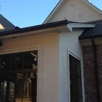 Dark gutter along the roof edge above a screened porch